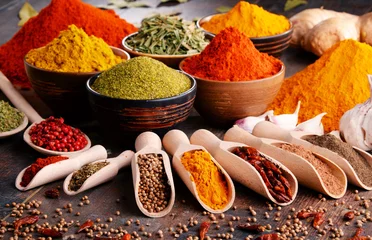 Foto op Aluminium Variety of spices and herbs on kitchen table © monticellllo