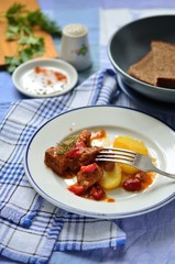 Beef goulash with sauce and potatoes