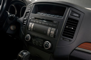 Car dashboard with buttons. Interior detail.