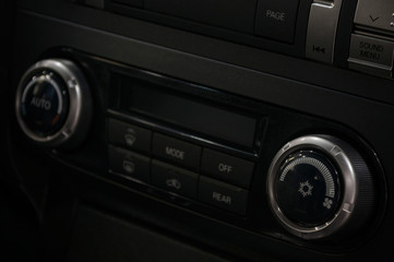Modern car climate control panel. Interior detail.