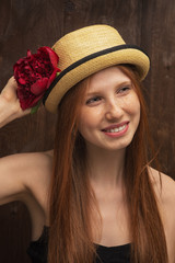 Red-haired girl with red flower
