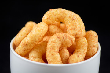 Flips snack in the white mug on black background