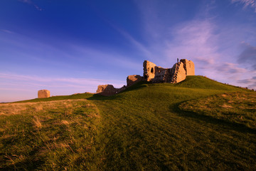 Duffus Castle, Elgin, Moray, Scotland is a ruined stone built motte and bailey fortress first constructed in the 12th century and finally abandoned in 1705.