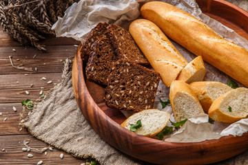 Loaf, bread in wooden saucer