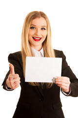 Naklejka premium cute young business woman golds blank paper with place for adver