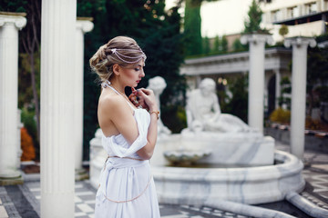 Naklejka premium portrait of a beautiful fashion model wearing an elegant dress