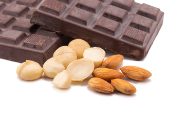 macadamia  almonds and dark chocolate isolated on white backgrou