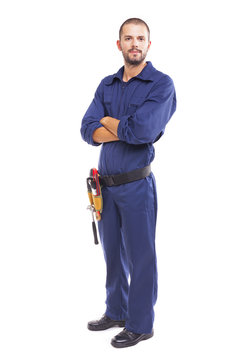 Young worker standing with arms crossed on white background - fu