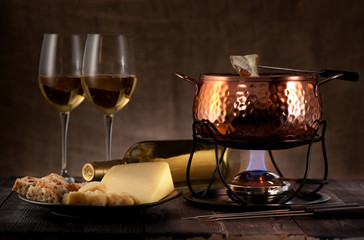 cheese fondue on rustic background
