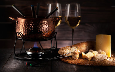 Swiss fondue cheese on rustic background