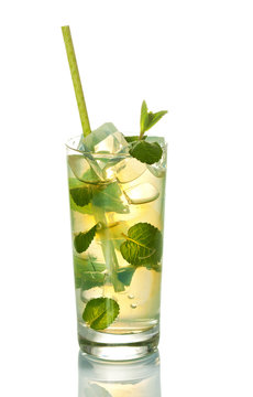 Glass of cold refreshing drink with ice and mint