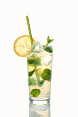 Glass of cold refreshing drink with ice and mint