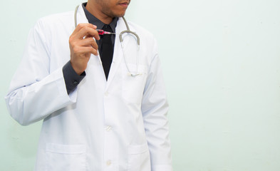 Doctor filling the medical syringe