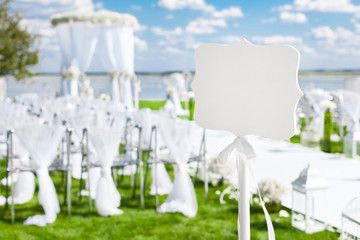 Celebration wedding sign on a green lawn. Event outdoor