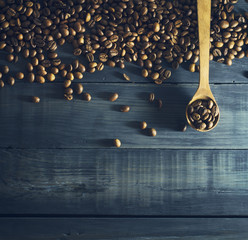Coffee beans with old wooden spoon