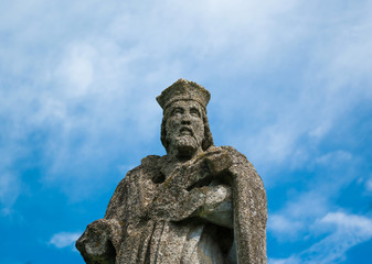 Fototapeta na wymiar Ancient statue of a saint
