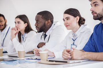 Fototapeta premium Outgoing doctors listening lecture at conference