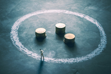  Miniature figure businessmen walking around the outside of chal