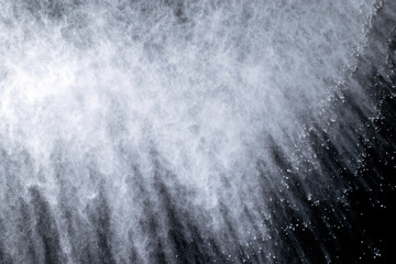 abstract powder explosions isolated on black background.