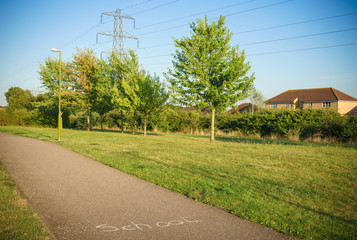 Pedestrian path with school writing at sunny day