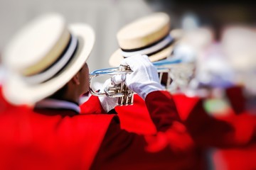 Brass Band in red uniform performing
