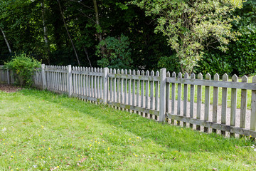 Wooden fence on private propert land seperated from walking path