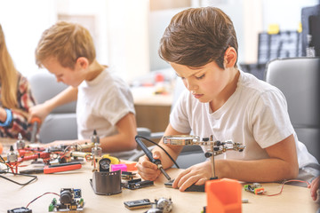 Concentrated children in light workshop