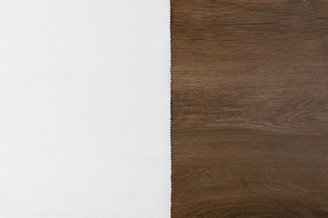 White material from left side wooden table. Velvet and wood background with empty place.