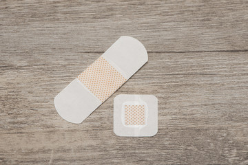 Plasters on wooden table