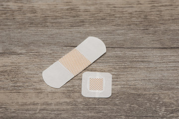 Plasters on wooden table