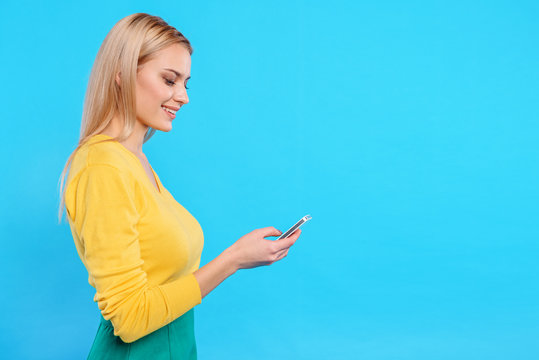 Cute Young Woman Using Mobile Phone