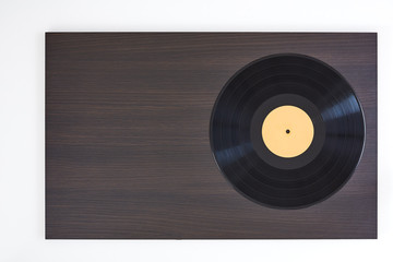 Vinyl record on wooden board