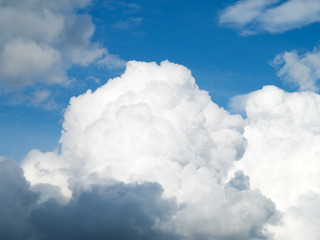 huge clouds on a blue sky background.