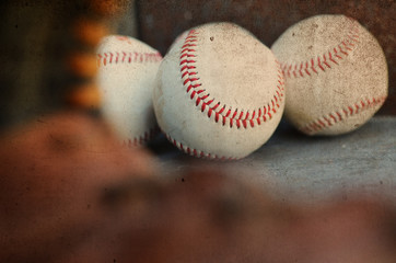 Baseballs through the eye of the glove, rustic vintage balls for background or graphic elements.