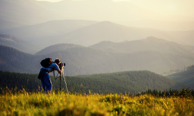 photographer photographed mountains in summer, photographs fog - obrazy, fototapety, plakaty