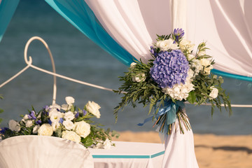 Setting up a wedding on the beach.