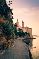 View of the town of Rab, Croatian tourist resort. - 136732326