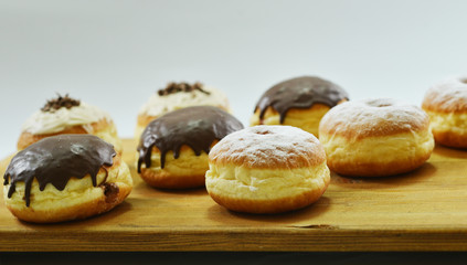 Close up. Beautifully arranged delicious doughnuts with icing, s