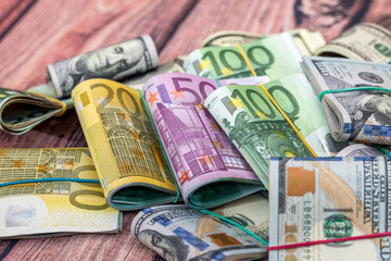 Obraz na płótnie Canvas Folded stack of dollar, euro banknotes as background
