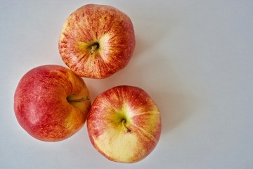 Three red gala apples