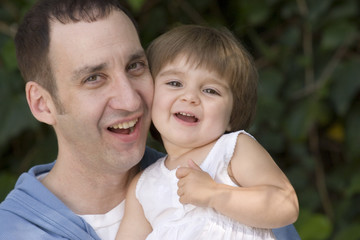 Fototapeta premium Portrait of a happy father and his daughter.