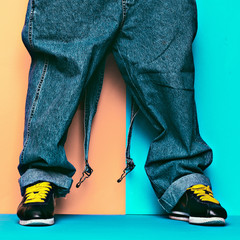 Stylish Jumpsuit. Urban Style. Sneakers and denim