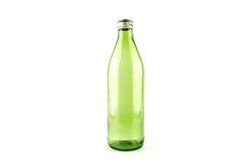 Glass empty green bottle isolated on a white background