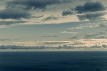 Fototapeta na wymiar Beautiful and terrible horizon of the black sea with dark clouds