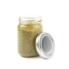 Glass jar of italian pesto isolated