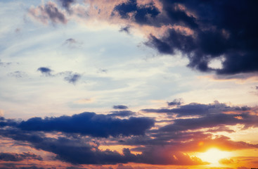 Naklejka na ściany i meble cumulus clouds at sunset.