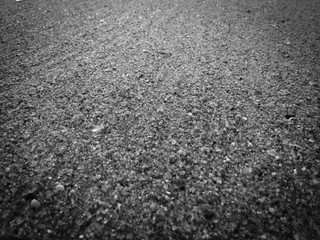 Black volcanic sandy surface ocean sea beach backdrop top view background