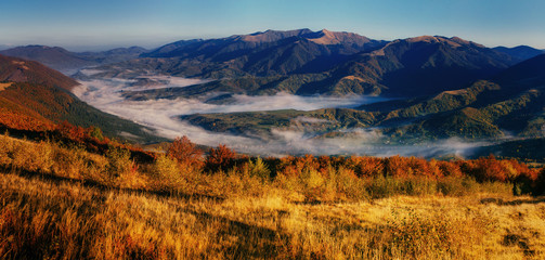 View of misty fog mountains in autumn, Carpathians, Ukraine.