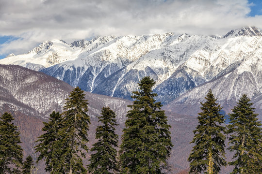 Beautiful mountain scenery of the Main Caucasian ridge with snowy peaks at winter