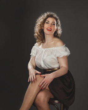 Girl in the style of Marilyn Monroe, pin-up style, Studio photography in artistic treatment
